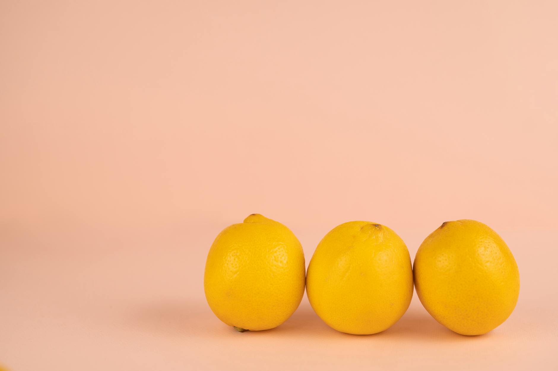 Vibrant collection of colorful sex toys arranged on bright yellow surface, showcasing diverse options for pleasure