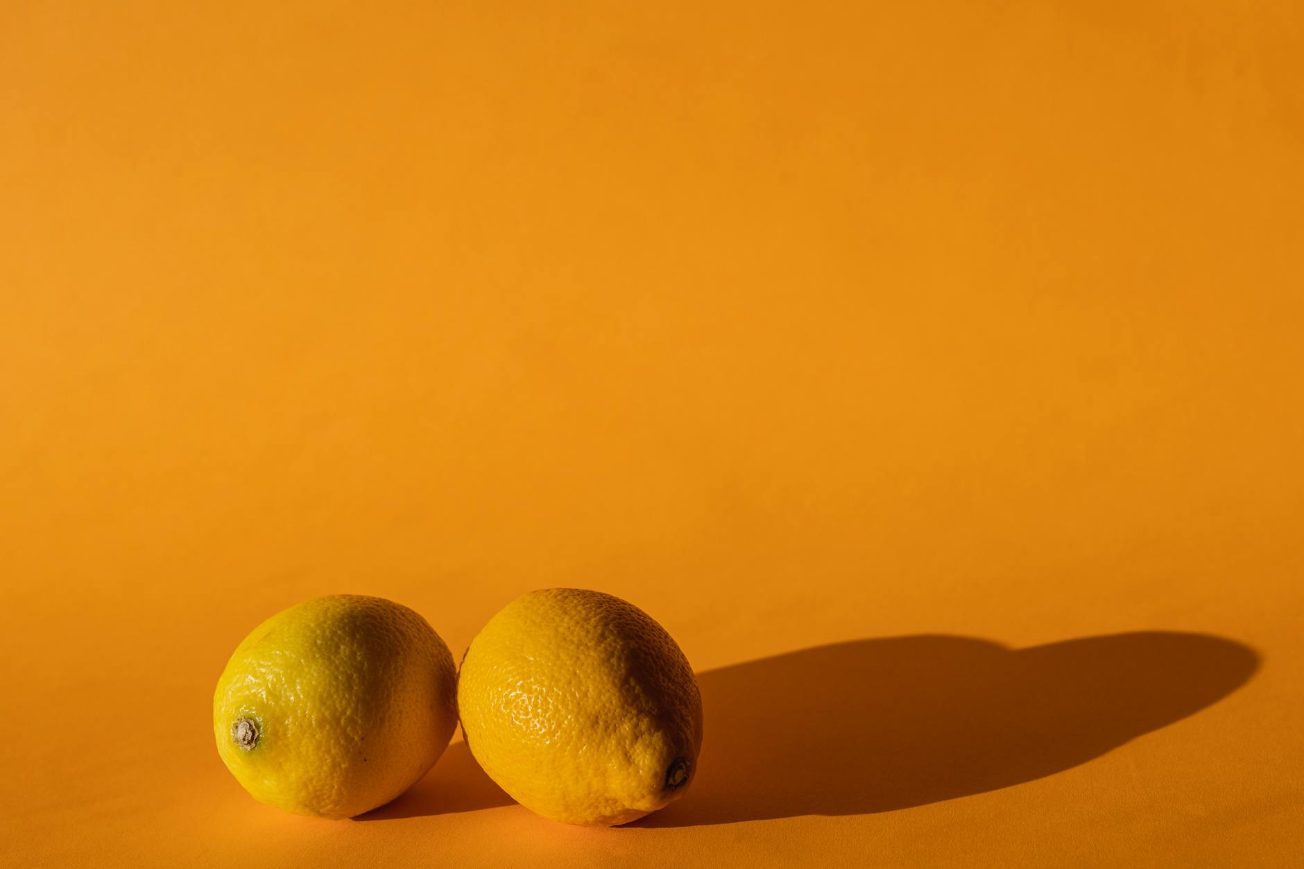 Vibrant collection of colorful lemon-inspired vibrators on a bright yellow surface